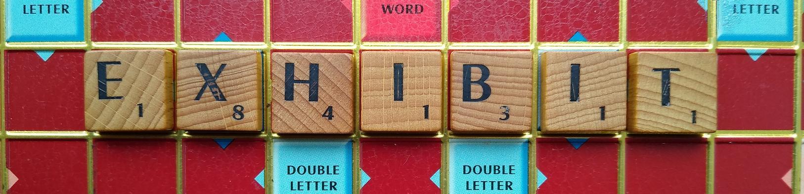 exhibit-word-spelled-with-scrabble-tiles